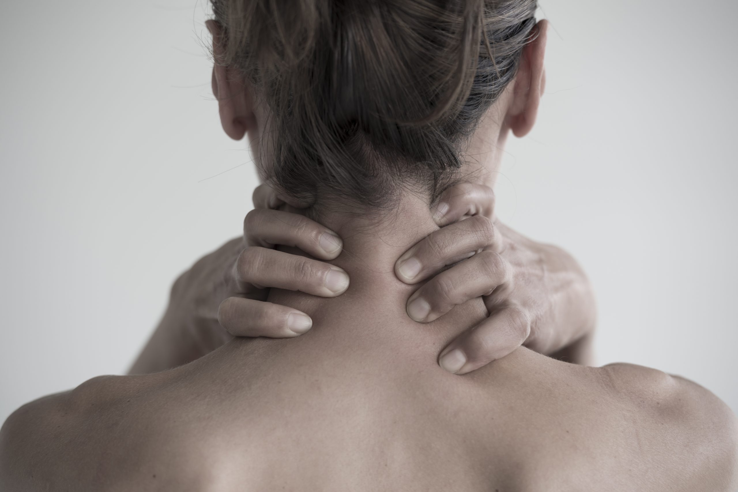 female having neck pain